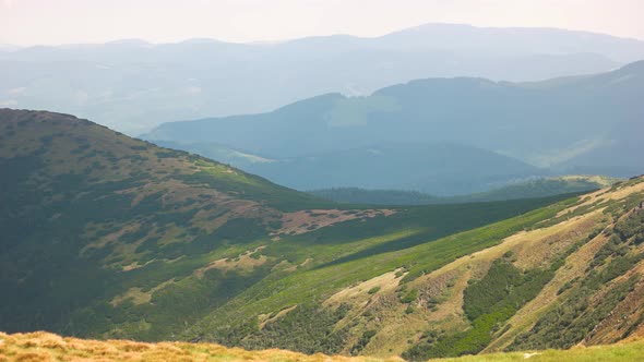 Panorama of Green Hills in Summer Mountains