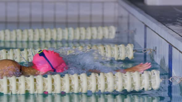 Swimmer training in a swimming pool