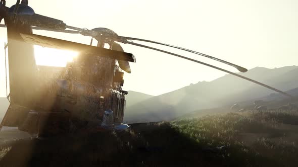 Old Rusted Military Helicopter in the Desert at Sunset