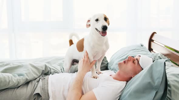 Man with Dog in the Bed