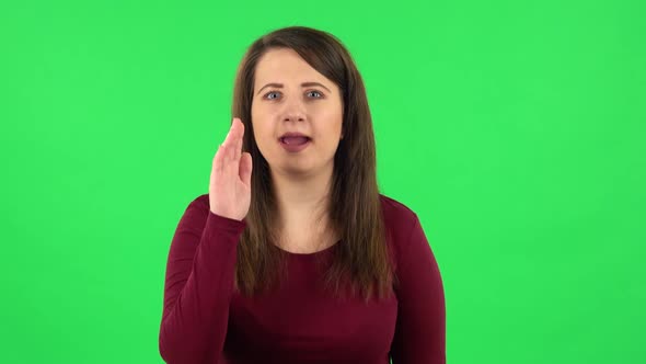 Portrait of Pretty Girl Is Screaming Calling Someone. Green Screen