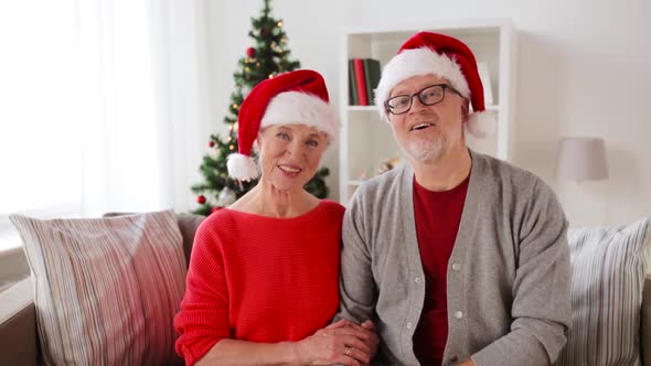 Senior Couple Recording Christmas Video Greeting