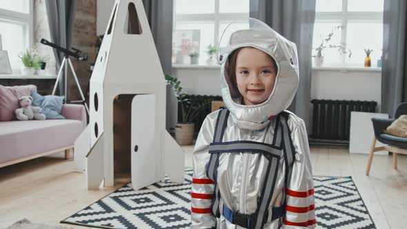 6-Year-Old Girl in Spacesuit Posing