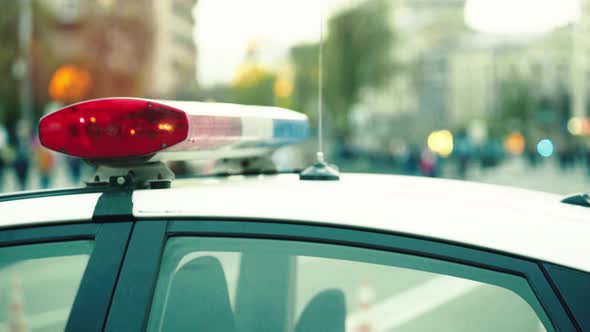 Flashing Flasher on the Roof of a Police Car. Blinker. Close-up.