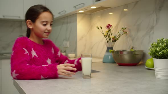 Charming Girl Drinking Milk Relishing Freshness of Dairy at Home