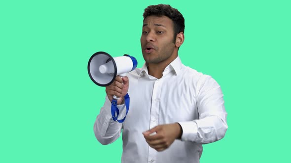 Emotional Businessman Talking Into Megaphone