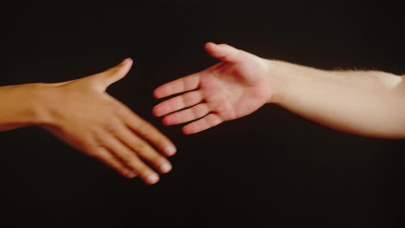 Diverse People Making Handshake Gesture Isolated on Black Background