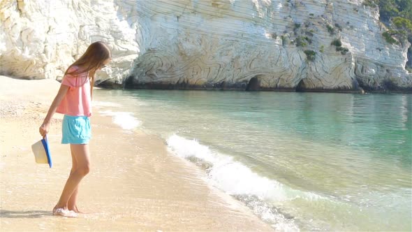 Adorable Little Girl on the Seashore Alone