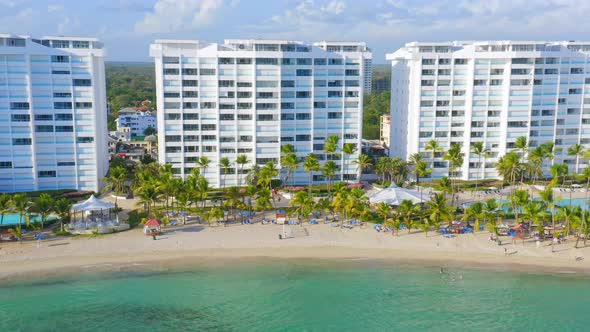 White Marbella towers on Hemingway Real beach on tropical island tourist destination, Dominican Repu