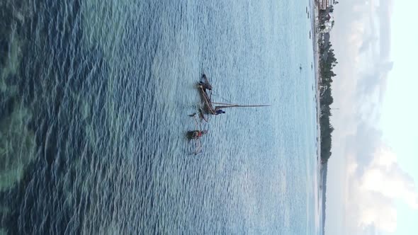 Vertical Video Boats in the Ocean Near the Coast of Zanzibar Tanzania Aerial View