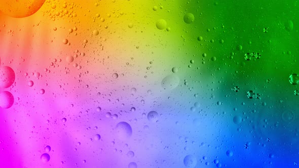Super Slow Motion Shot of Moving Oil Bubbles on Bright Colorful Background at 1000Fps
