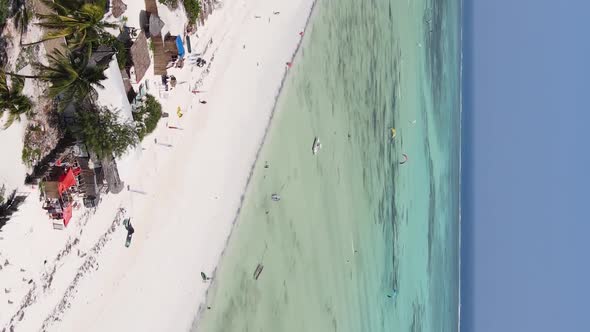 Vertical Video Boats in the Ocean Near the Coast of Zanzibar Tanzania Aerial View