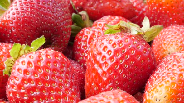 Red organic  strawberry many fruit pieces background 4K 3840X2160 UltraHD footage - Natural fruit re