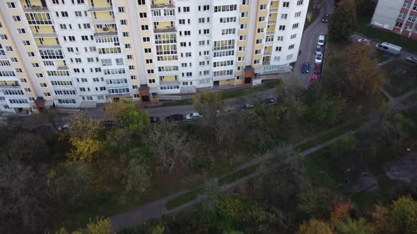 Aerial view of a drone flying over the residential buildings, roof shooting and architecture.