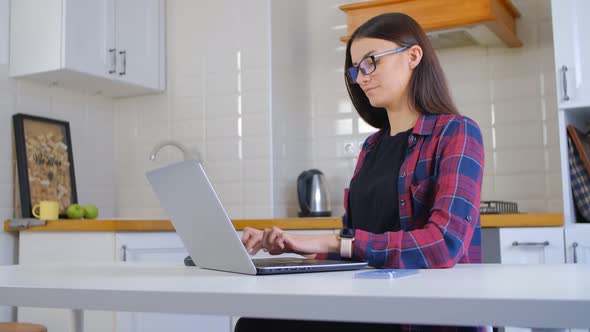 Freelancer girl working on notebook computer at home on lockdown in 4k video