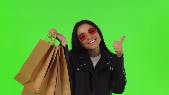 Happy Woman Showing Thumbs Up After Shopping