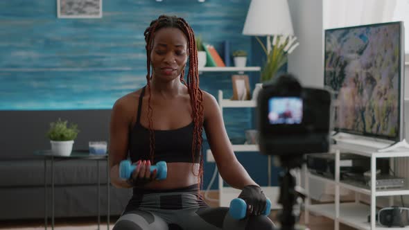 Slim Black Trainer Doing Morning Yoga Exercices Sitting on Fitness Swiss Ball