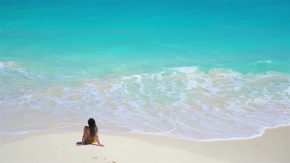 Young Woman on the Beach in Water View Above