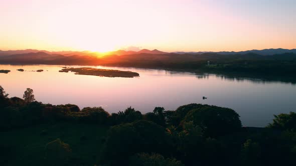 4K flying a drone over a river and wetland area