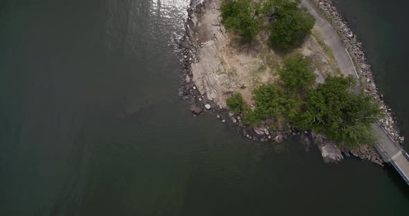 Top Down Aerial of a Lake and a Bridge Connected to a Small Island