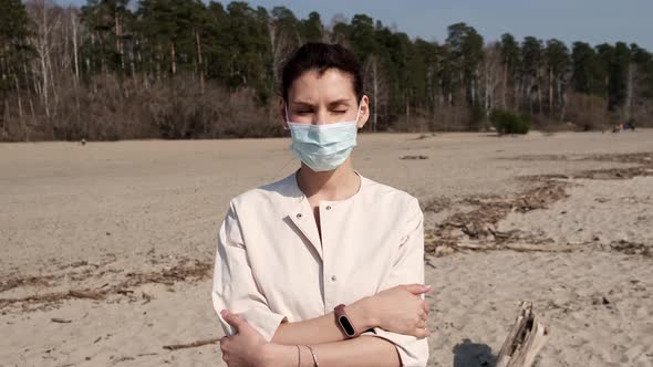 Young Girl in Medical Mask, Being Outdoors During Quarantine During Pandemic Covid-19, Looking at