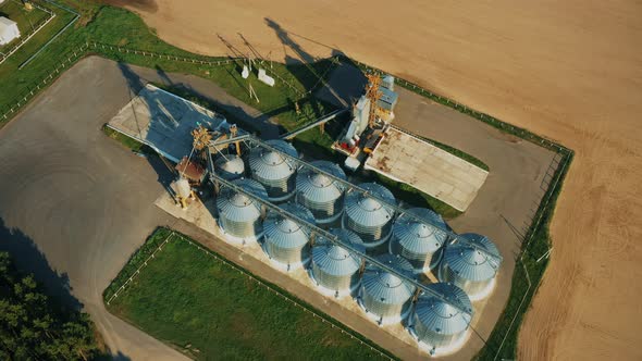 Aerial Elevated Top View Modern Granary Graindrying Complex Commercial Grain Or Seed Silos In Sunny