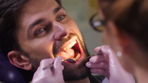 Portrait of Man with Open Mouth in Dental Office