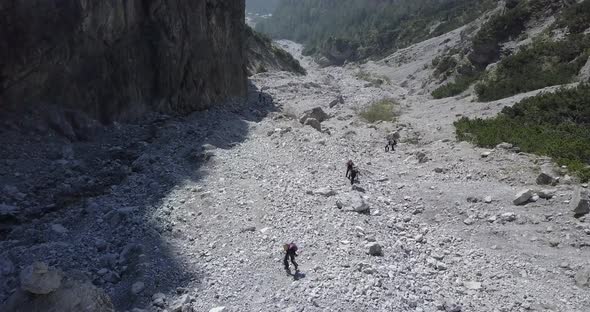 Aerial drone view of hikers hiking in the mountains