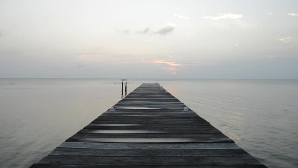 Boat Passing On Dawn Horizon alt
