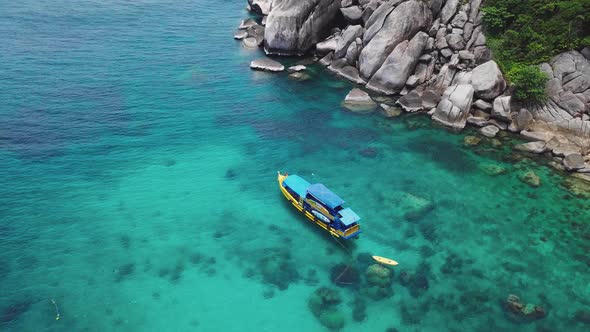 Boats Anchoring in Turquoise Shallow Water By the Edge of Coral Reef