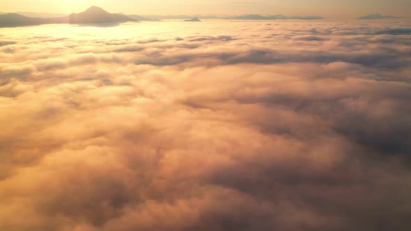 4K Drone Flying through the clouds at dusk or dawn. Aerial top cloudscape