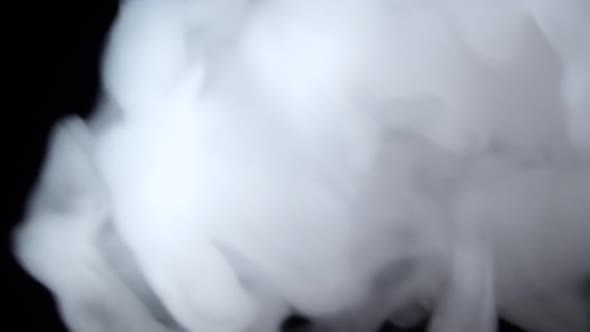 White Smoke Floating Through Space Against Black Background. Mist, Smoke , Vapor, Fog Effect. Slow