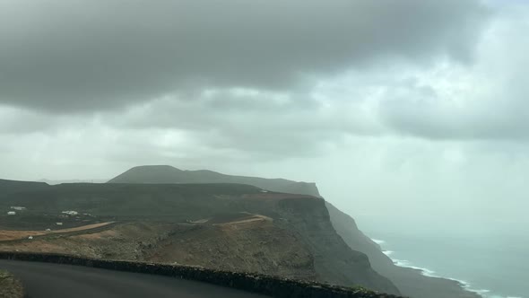 Driving on the coast of Lanzarote. Cliff edge and mountain roads