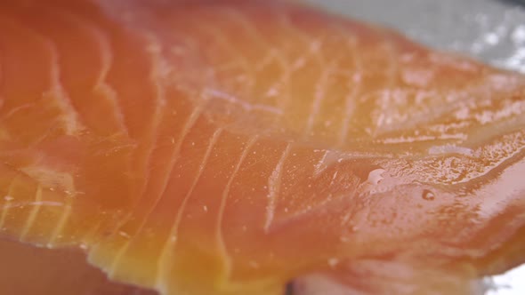 A piece of cooked salted fresh salmon fish is stacked in a stack