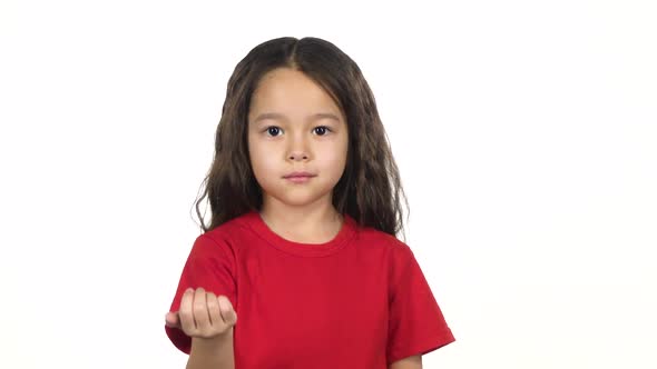 Little Woman Waves Her Hand To Herself at White Background. Slow Motion