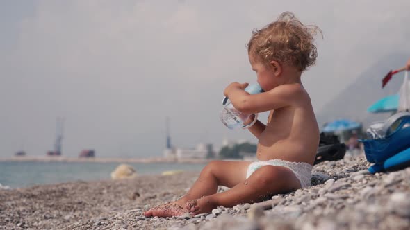 Little Baby Boy on the Beach Playing