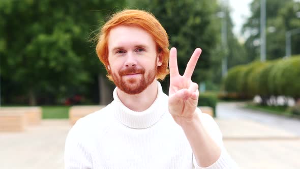 Victory Sign by Man with Red Hairs, Outdoor