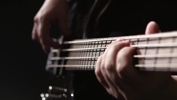 Close Shot of the Strings on a Bass Guitar