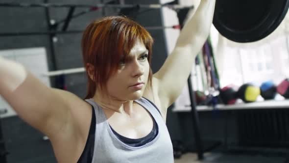 Sportswoman Doing Overhead Squat