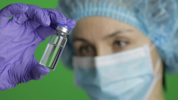 Female Scientist Holding Ampoule in Hand, New Medication Developing, Vaccination