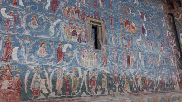 Blue Painted Wall Of Orthodox Church - Voronet Monastery In Woronet, Romania