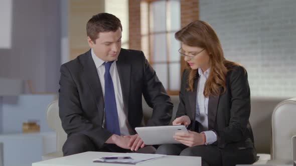 Female Employee Showing Financial Charts, Presentation to Boss