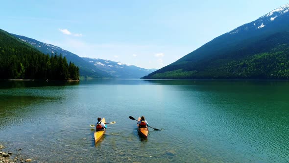 People kayaking in lake 4k