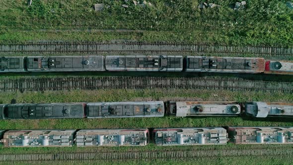 Aerial Top Down Shot of an Abandoned Rusty Locomotives and Old Railways