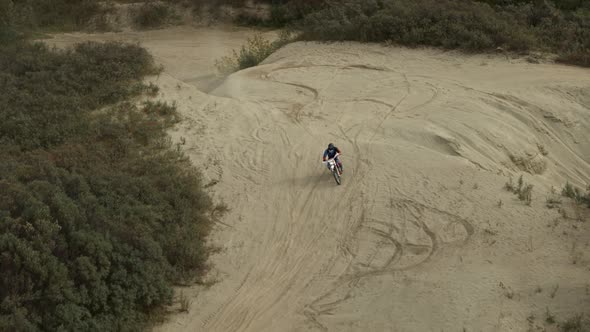 Enduro Motorcycle Rides Offroad on the Sands