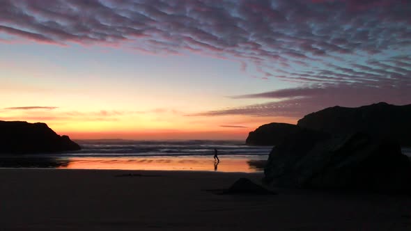 Person jogging and staying fit, running at sunset at an Oregon coast beach