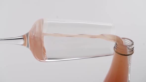 Vertical video, Close-up: alcoholic liquor being poured into a glass