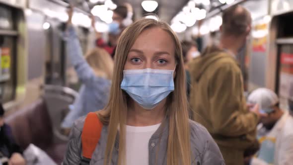 Portrait of Woman in Medical Mask Posing in Subway