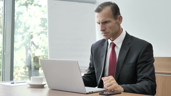 Angry Businessman Screaming in Depression at Work