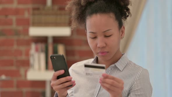 Portrait of African Woman with Online Payment Failure on Smartphone